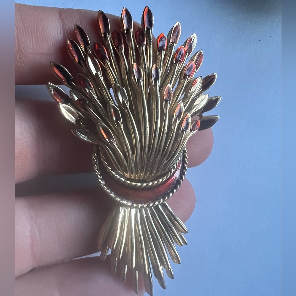 Vintage 1960s Crown Trifari wheat sheaf brooch featuring red enamel accents